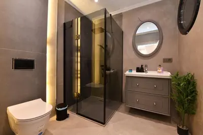 a bathroom with a shower and a toilet and a sink at chic ve modern daire taksim meydani in Istanbul