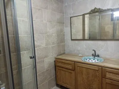 a bathroom with a sink and a shower at Duru Hanım Konağı in Mudanya