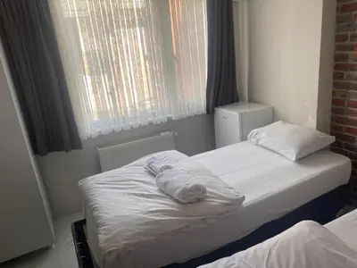 a bedroom with two beds with towels on them at lastbest hotel in Istanbul