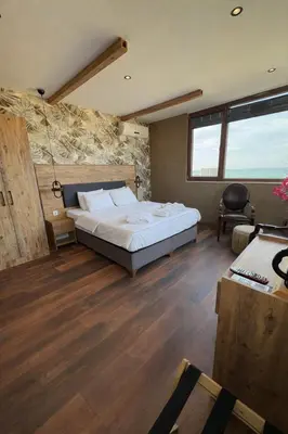 a bedroom with a large bed in a room at Goga Otel in Sarıyer