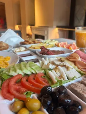 a table with many different types of food on it at Pera Standard Rooms in Istanbul