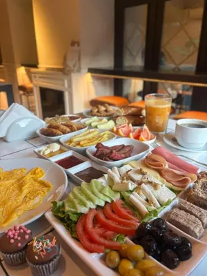 a table with many different types of food on it at Pera Standard Rooms in Istanbul