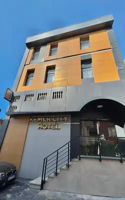 a building with a hotel sign on the side of it at Kemer City Hotel İstanbul Airport in Kemerburgaz
