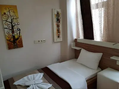 a small room with a bed and a window at Altun Life City in Istanbul