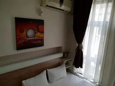 a hotel room with a bed and a window at Altun Life City in Istanbul