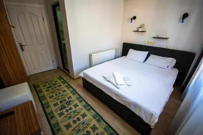 a bedroom with a bed with two towels on it at Altun Life City in Istanbul