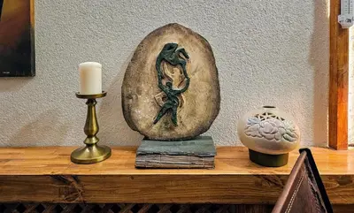 a shelf with a candle and a statue on it at MAHZEN Otel in Istanbul