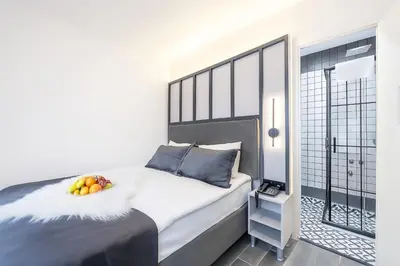 a bedroom with a bed with a bowl of fruit on it at Big Urban Taksim Terrace Stay in Istanbul