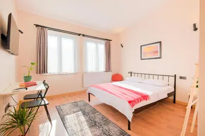 a bedroom with a bed and a desk at Casa Nozze in Istanbul