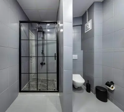 a bathroom with a shower and a toilet at Cenova Suite Hotel in Istanbul