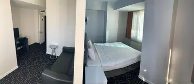 two pictures of a room with a bed and a chair at Anı Park Hotel in Pendik