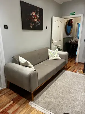 a gray couch in a living room at Taksim Green Flat Apartment in Istanbul