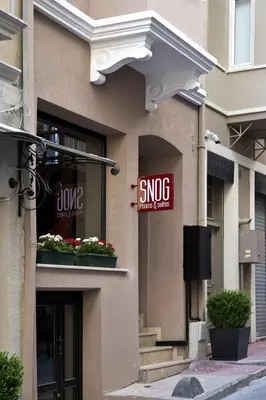 a building with a snoc sign on the side of it at Snog Rooms & Suites in Istanbul