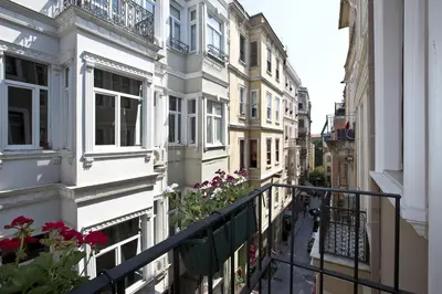 a city street with buildings and flowers on a balcony at Snog Rooms & Suites in Istanbul