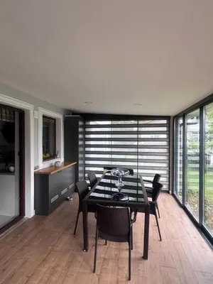 a dining room with a table and chairs at Cadde Sapanca Sıcak Havuzlu Geniş Bahçeli in Sapanca
