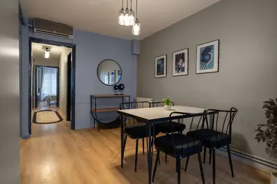 a dining room with a table and chairs at Cozy and Modern 3BR with Private Patio in Beşiktaş in Istanbul