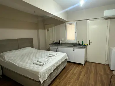 a bedroom with a bed with two towels on it at Kaman Home Apart in Istanbul