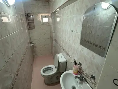 a small bathroom with a toilet and a sink at Kaman Home Apart in Istanbul