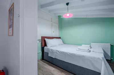 a bedroom with a bed with towels on it at Cozy Private Home in Kadıköy – Near Coast Ferry in Istanbul