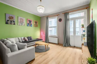 a living room with a couch and a tv at Cozy Private Home in Kadıköy – Near Coast Ferry in Istanbul