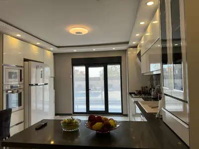 a kitchen with a bowl of fruit on a table at Lux Villa Silivri Kavakli in Silivri
