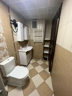 a bathroom with a toilet and a sink at Massa Home TAKSİM in Istanbul