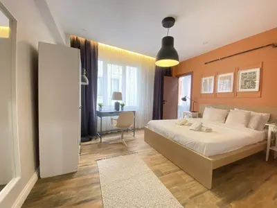 a bedroom with a bed and a desk in it at Central Comfortable Flat in Historic Balat in Istanbul