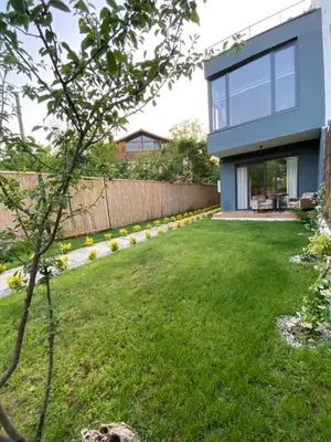 a modern house with a green yard at Fcvillasapanca in Sapanca