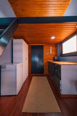 a kitchen with a wooden ceiling and a window at Sapanca Sunday Bungalov Resort Otel in Sapanca
