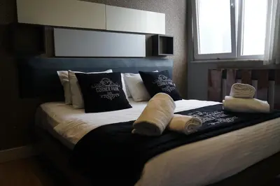 a bedroom with a bed with towels on it at SE Group Corner Suites in Istanbul
