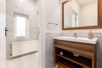 a bathroom with a sink and a mirror at Akçe 6 in Istanbul