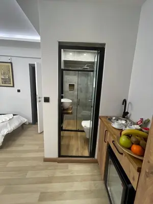 a bathroom with a sink and a toilet and a mirror at Deluxe Valeria in Istanbul