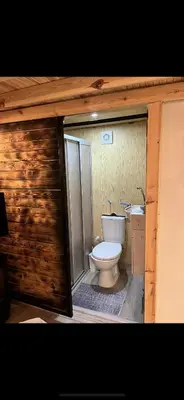 a bathroom with a toilet and a sink at Galaxy Housing