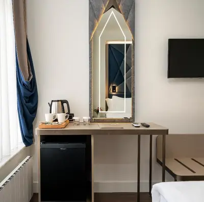 a dressing table with a mirror on a wall at Adamar Hotel-Special Category in Istanbul