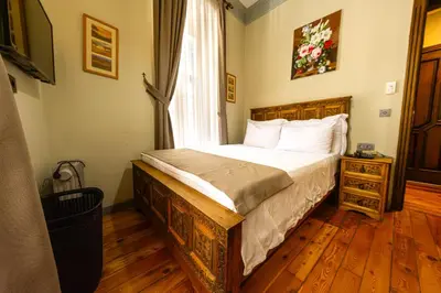 a bedroom with a bed and a window at Flex Pera in Istanbul