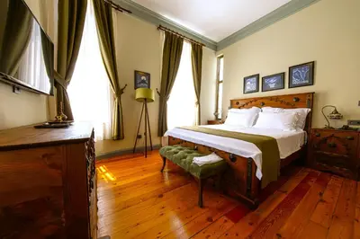a bedroom with a large bed and a window at Flex Pera in Istanbul