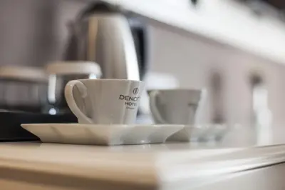 two coffee cups sitting on a counter top at Dencity Hotels & Spa in Istanbul