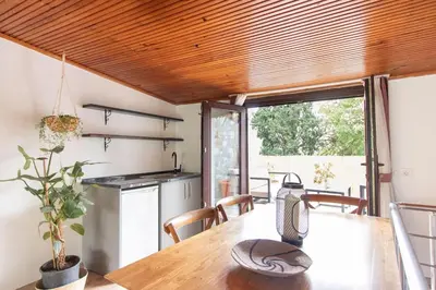 a dining room with a table and a kitchen at 3BR Villa with Garden & Terrace in Kadikoy in Istanbul