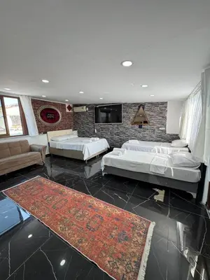 a living room with two beds and a couch at beyzade palace in Istanbul