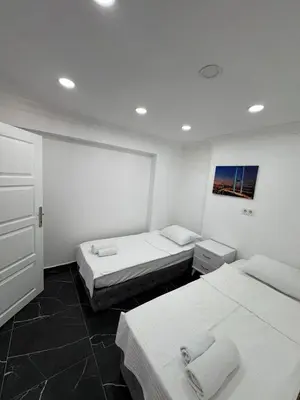 two beds in a room with two beds sidx sidx sidx sidx at beyzade palace in Istanbul