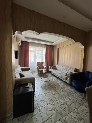 a living room with two couches and a couch at beyzade palace in Istanbul