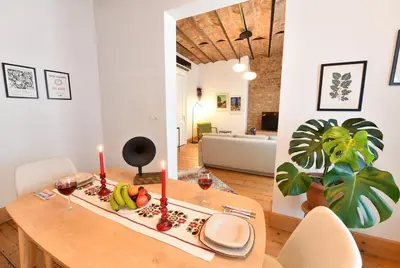 a dining room with a table with fruits and candles at Charming Flat Retro Design AC Galata in Istanbul