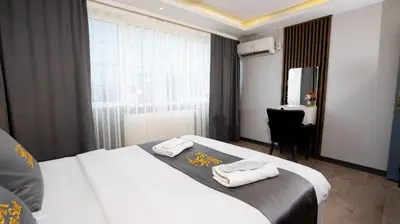 a hotel room with a bed with towels on it at Sara Suit in Istanbul
