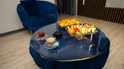 a blue coffee table with a tray of fruit on it at Sara Suit in Istanbul