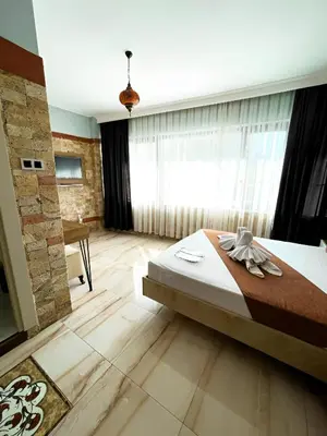 a bedroom with a bed and a large window at The Lumina Hotel in Istanbul