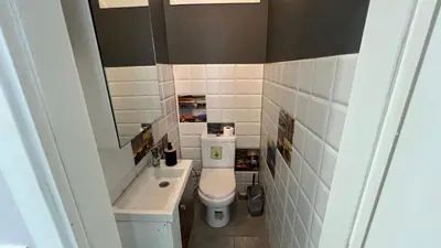 a small bathroom with a toilet and a sink at Taksim Square Luxury 4BR Next to Hotels Perfect for Families & Groups in Istanbul