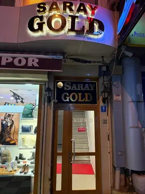 a sign on the door of a saar gold store at GOLD SARAY PANSİYOn in Saray