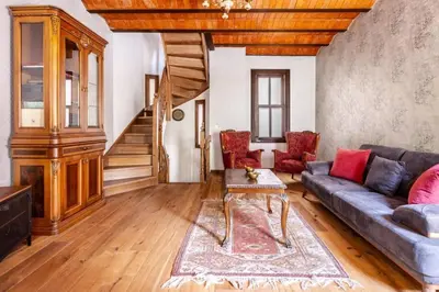 a living room with a couch and a table at Chic 2BR Retreat House - Heart of Cihangir! #394 in Istanbul