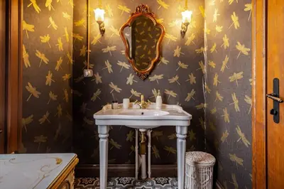 a bathroom with a sink and a mirror at Chic 2BR Retreat House - Heart of Cihangir! #394 in Istanbul