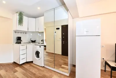 a kitchen with a washer and dryer in a room at Comfortable Bright Home AC Galata in Istanbul